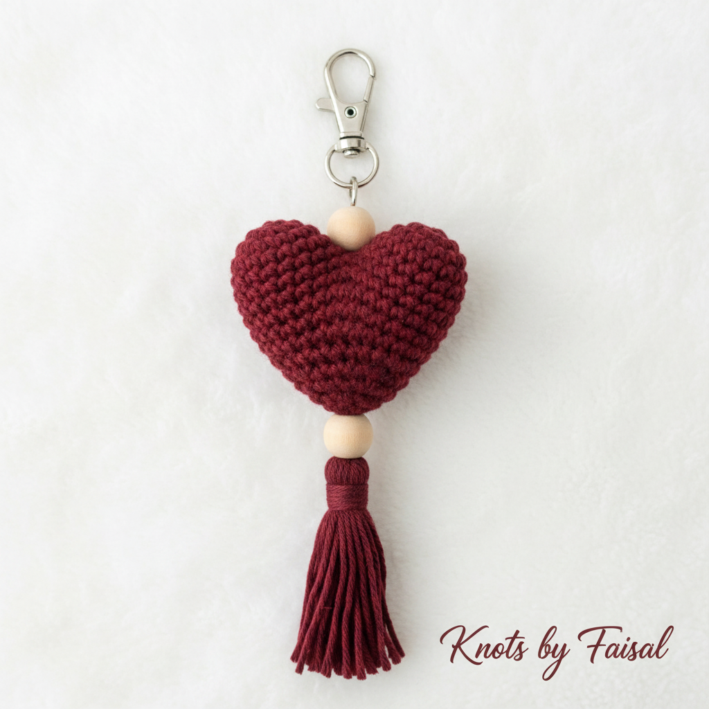 Maroon crochet heart keychain with tassel by Knots by Faisal
