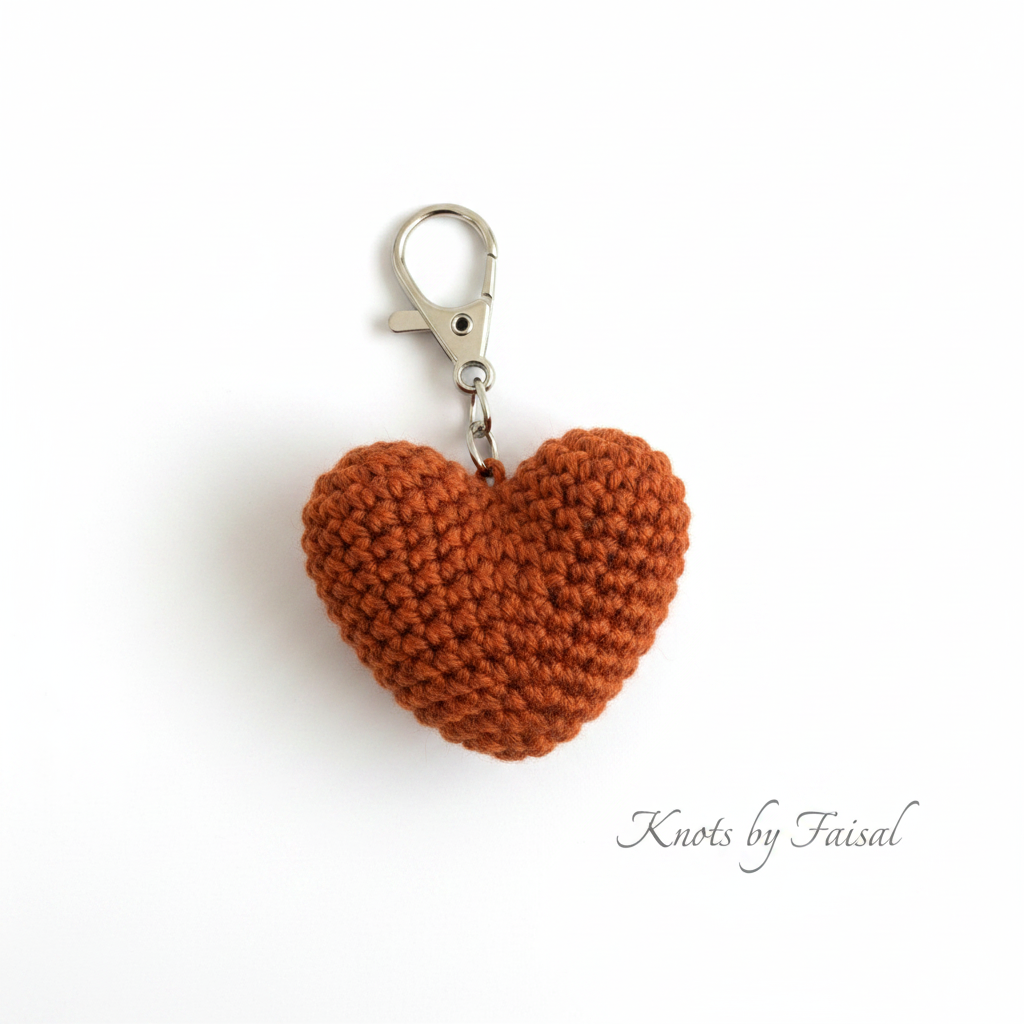 Dark orange crochet heart keychain by Knots by Faisal