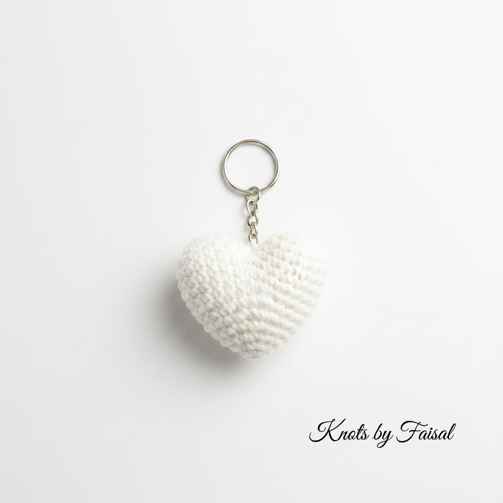 White crochet heart keychain by Knots by Faisal