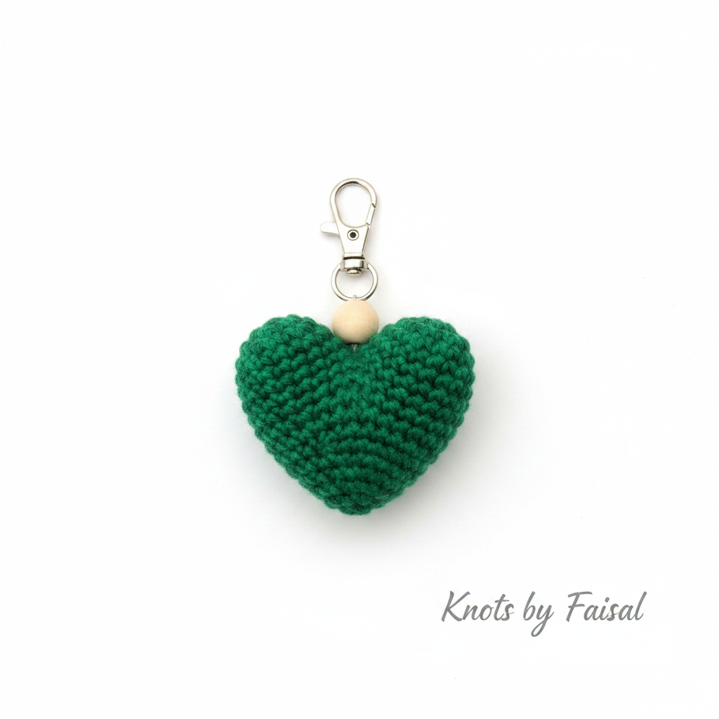 Green crochet heart keychain by Knots by Faisal