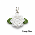 White crochet flower keychain by Knots by Faisal