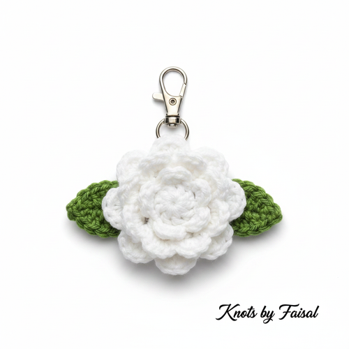 White crochet flower keychain by Knots by Faisal
